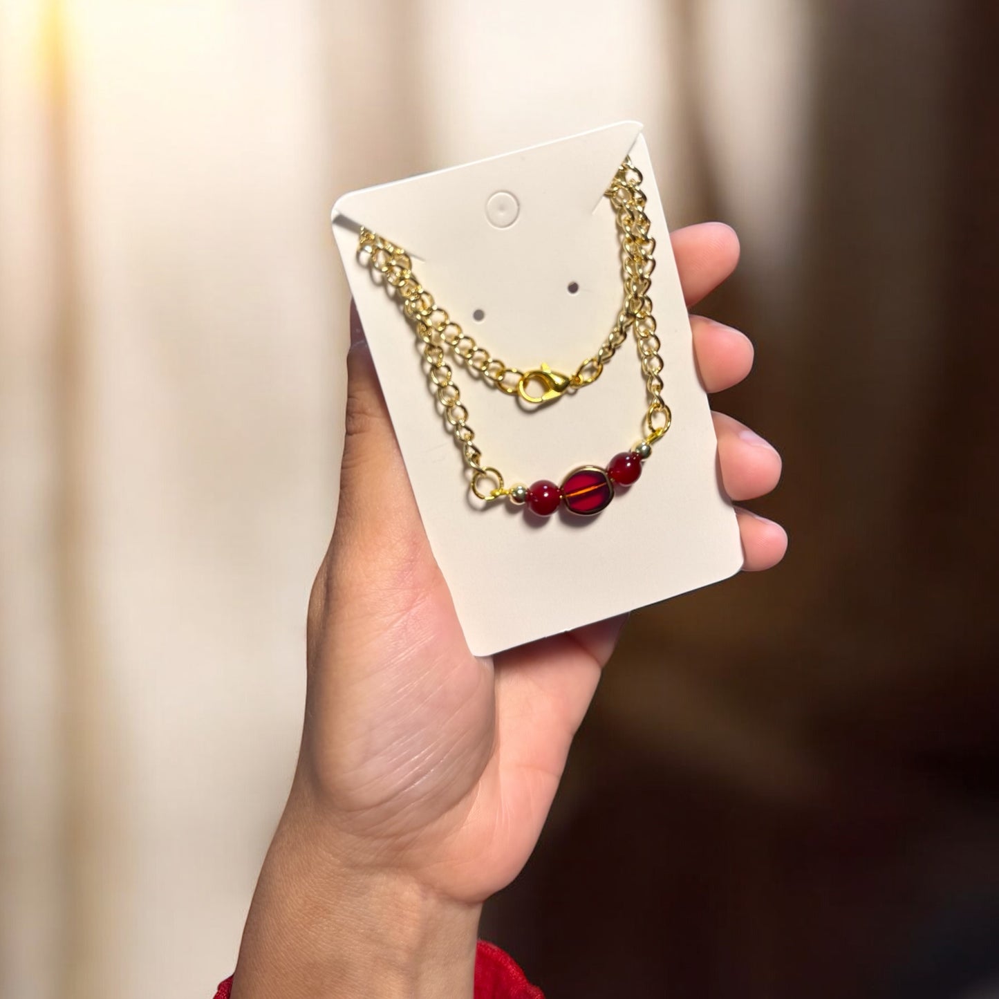 Gold Necklace with Red Charm